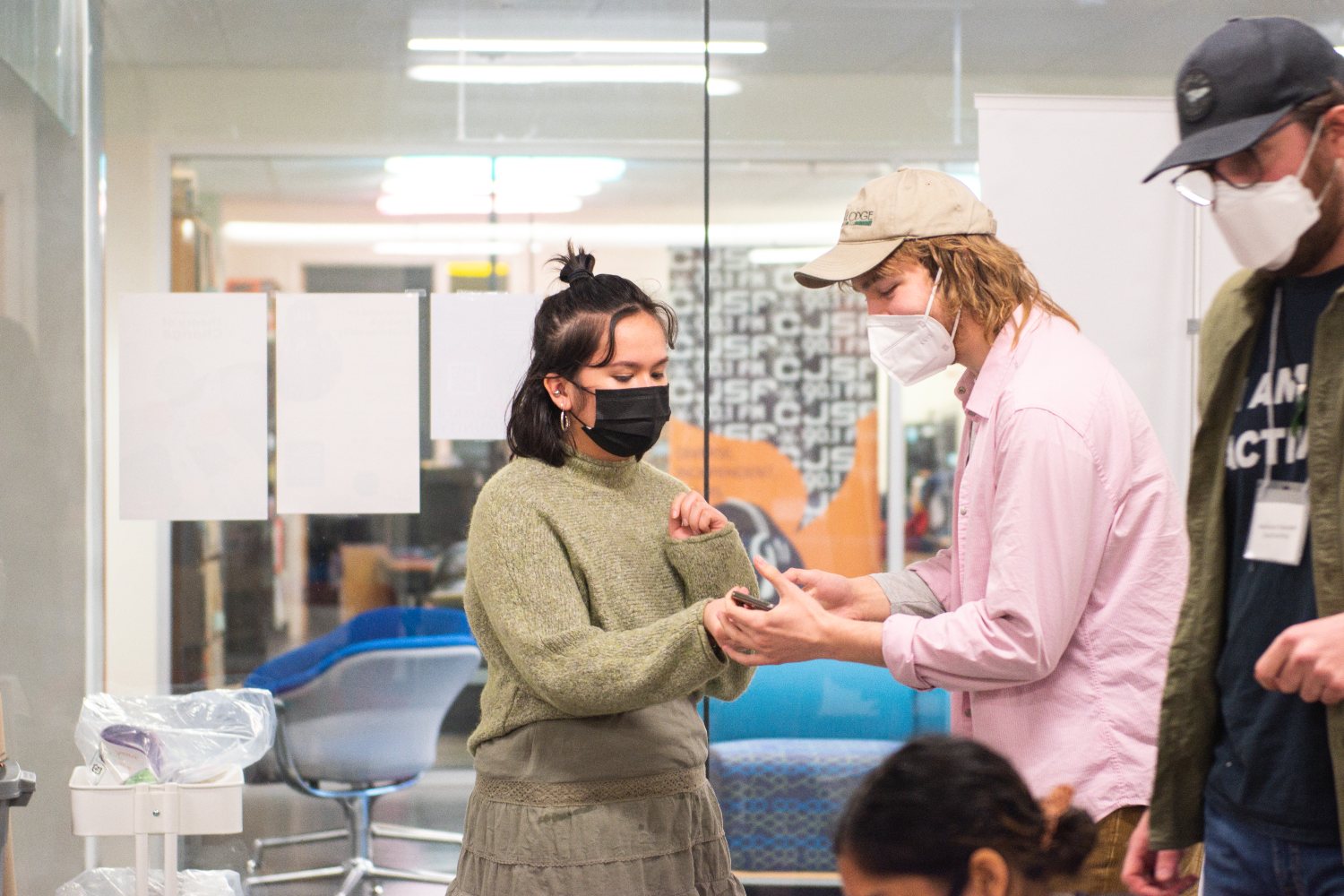 People stand in conversation in the Embark Studio.