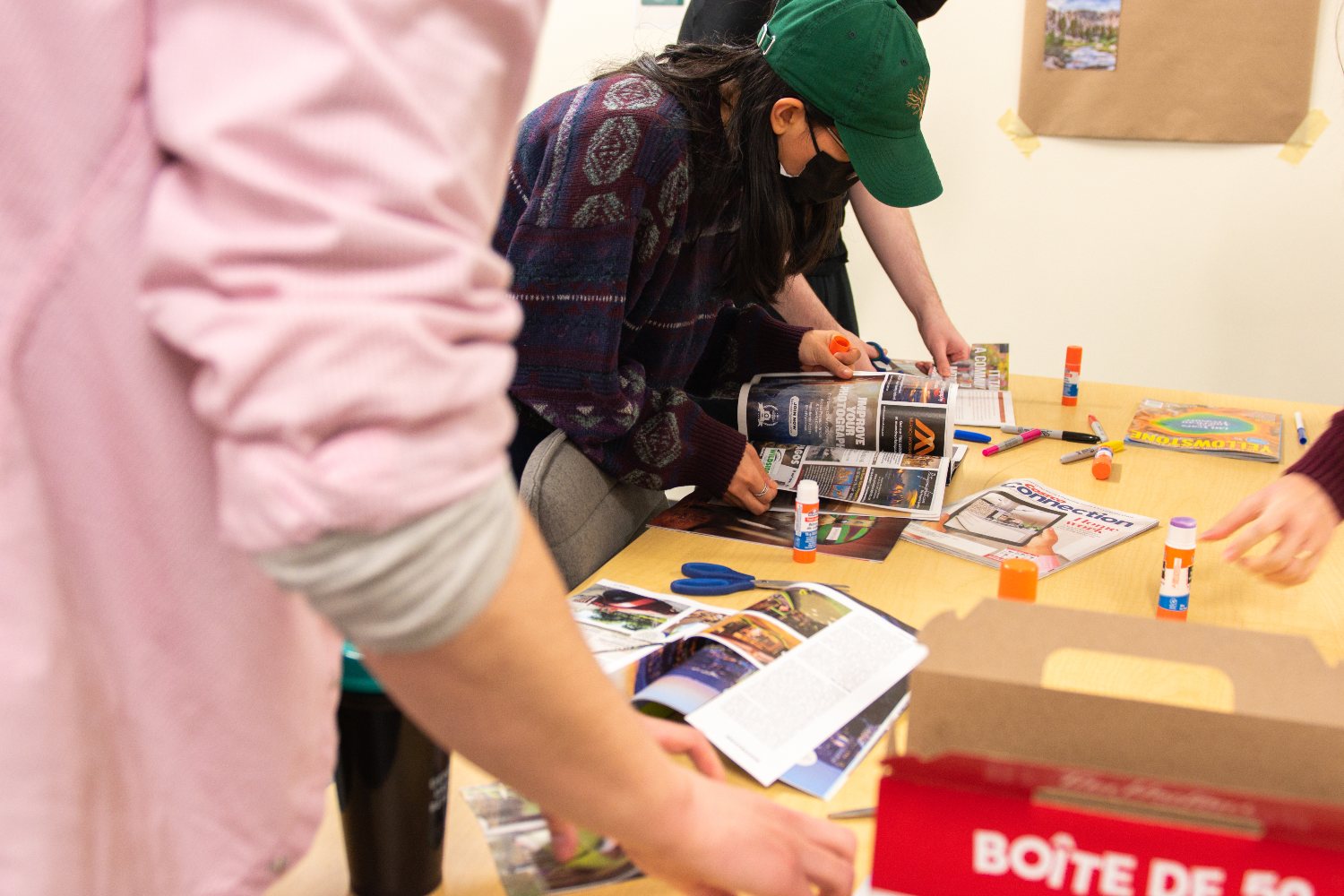 Participants working on magazine collage.